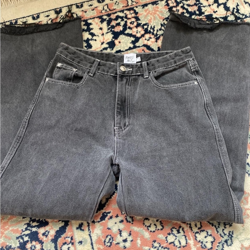 Princess Polly cutoff faded black jeans with contrast stitching.